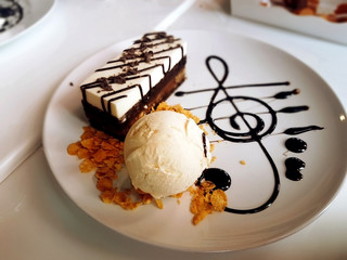 Ice cream with chocolate cake.