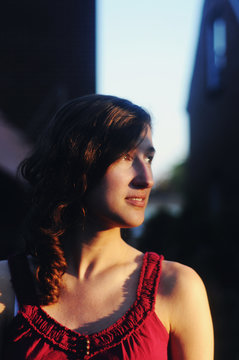 Young woman looking at the sunset