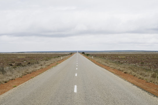Long Open Road Through A Salt Lake