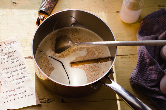 Cream and spices in a saucepan.