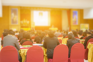 Student listening to Speaker Giving a Talk at Business Meeting marketing plan. Audience in the conference hall. Businessman and Entrepreneurship.unrecognizable people ,vintage color,selective focus