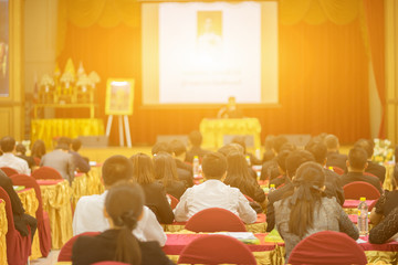 Student listening to Speaker Giving a Talk at Business Meeting marketing plan. Audience in the conference hall. Businessman and Entrepreneurship.unrecognizable people ,vintage color,selective focus