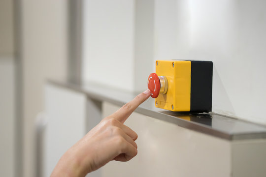 Finger of women pressing emergency sos button to contact with call center to ask for help after car accident ,hand trying to press in front of the elevator,safety first and security background concept