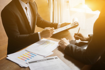 Project managers meeting.Business crew working with new startup,Teamwork concept,man and woman discussion document in the office.collaborative filtering.Analyze plans.selective focus,vintage color