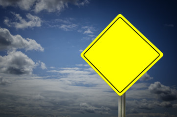 Blank yellow warning road sign with sky background