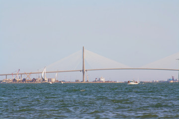 sailing boats on the background of the huge bridge