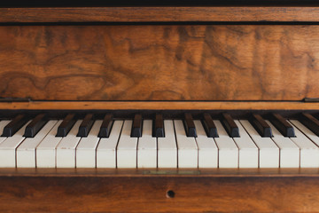 Close up of the keys of an old piano