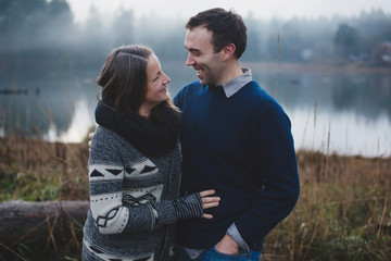 Candid moment of happy couple outside in winter
