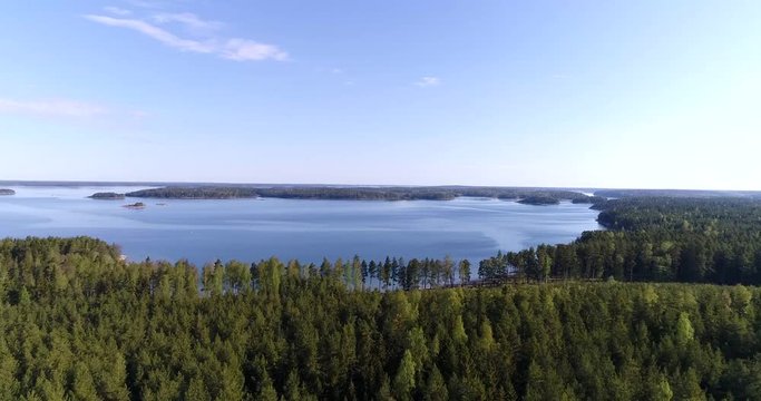 Beach in Finland, Cinema 4k aerial tilt view over olmos beach, on a sunny morning, in Kemionsaari, Uusimaa, Finland