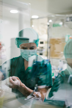 Couple of Surgeons Washing Hands Before Operating
