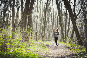 Fototapeta na wymiar A girl is walking in the park
