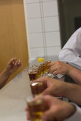 Men with alcohol shots on the bar
