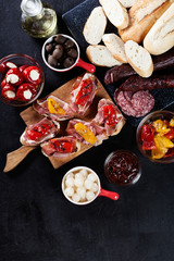 Spanish tapas with slices jamon serrano and grilled pepper. Also