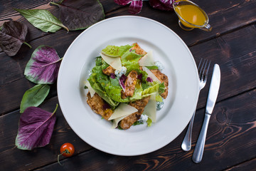  Salad with chicken on a wooden background top