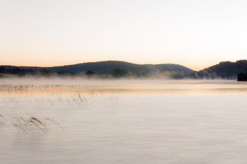 Mist at sunrise on Lake Ilay, in the French Jura