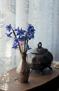 Old retro silver jewelry box with silver vase and flowers