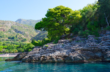 Obraz premium Picturesque rocky coast near famous Royal beach, Milocer, Montenegro