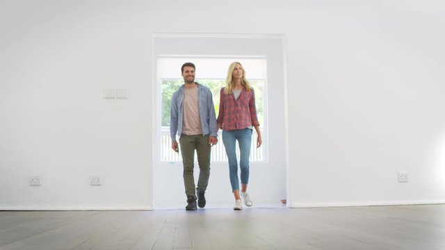 Excited Family Explore New Home On Moving Day