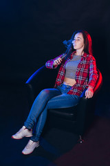  Woman smoking electronic cigarette with smoke