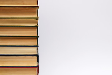 stack of different old books on a white background