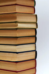 stack of different old books on a white background
