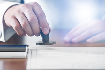 Notary public in office stamping document