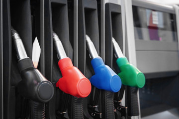 Colorful fuelling nozzles at gas station