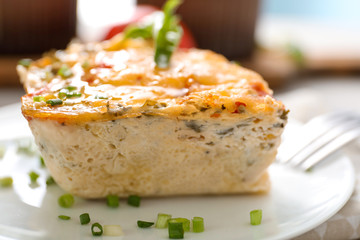 Plate with delicious turkey casserole on table, closeup