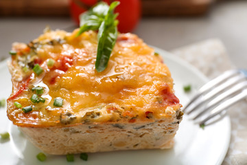 Plate with delicious turkey casserole on table, closeup