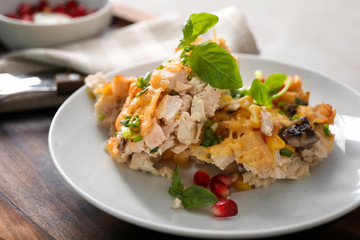 Plate with delicious turkey casserole on table, closeup