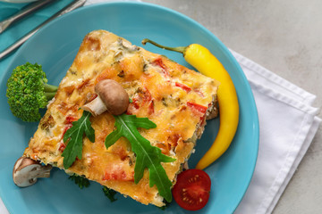 Plate with delicious turkey casserole on table, closeup