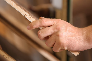 Carpenter choosing laminate samples in hardware store