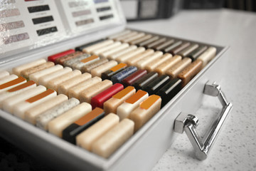 Different samples of solid surface for furniture in case