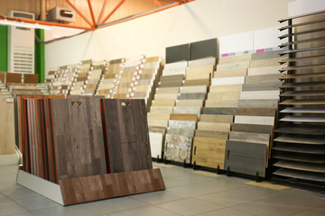 Assortment of laminated flooring samples in hardware store