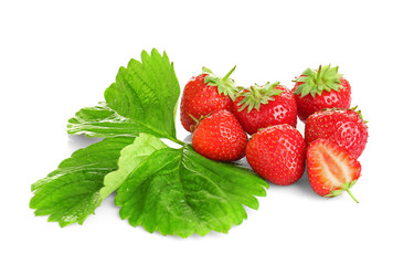 Ripe strawberries and leaves on white background