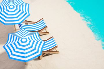 Beach furniture under umbrellas