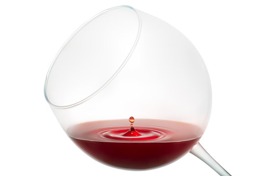 Wine drop splashing on glass isolated on white background