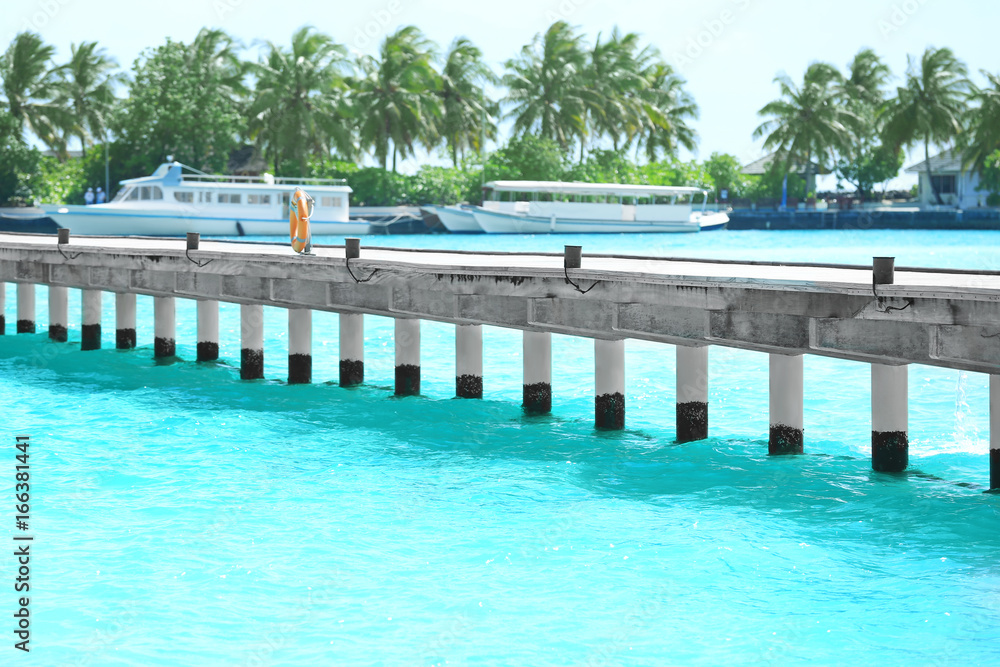 Sticker pontoon at sea resort and blurred berthed boats on background