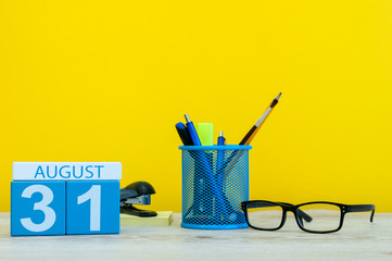 August 31st. Image of august 31, calendar on yellow background with office supplies. Summer time...