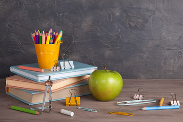 Back to school concept with school supplies. Colorful pencils, books with copy space