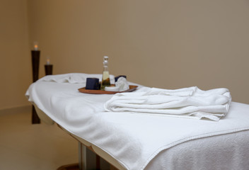 Massage table in modern spa salon