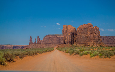 Fototapeta na wymiar Sandy dirt road in the Valley of Monuments