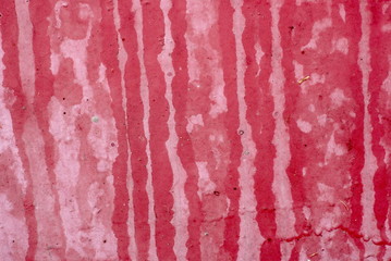 Old red paint on metal background