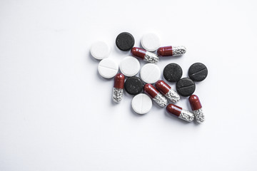 different pills on white