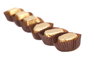 Chocolate balls with almond in gold foil paper