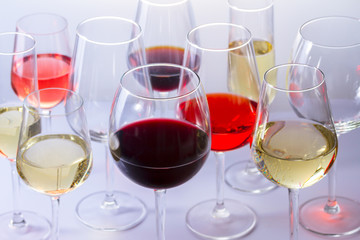 Set of party wine glasses with red, white and rose wine close up