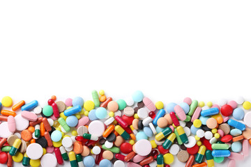 Fototapeta na wymiar Different colorful pills on white background