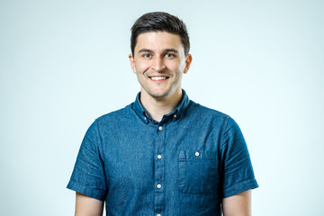 Portrait of handsome guy smiling at camera