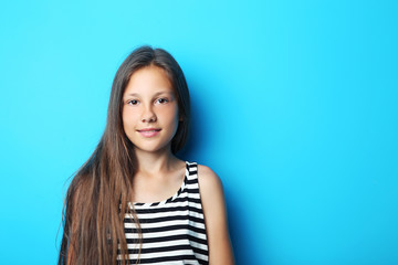 Portrait of beautiful girl on blue background