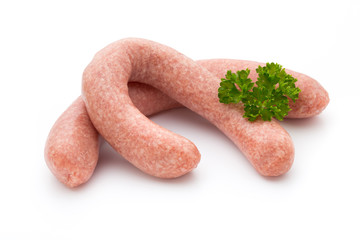 Raw sausages with herbs and spices.